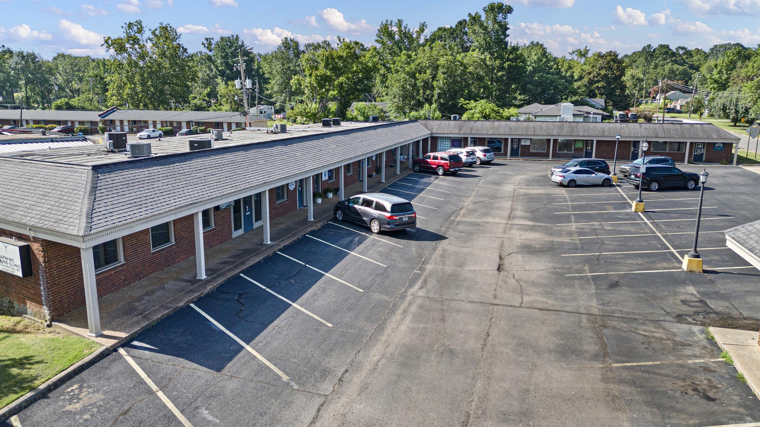 Located in the heart of West Russellville’s dense medical and professional office corridor, this well-maintained 12,000+ sq ft commercial complex offers a rare opportunity for both investors and owner-occupants. The property features multiple established tenants, ample lighted parking, and flexible suite configurations ideal for a variety of professional, medical, or business uses. Surrounded by high-traffic offices, clinics, and service providers, the location offers excellent visibility and accessibility. Whether you're looking to occupy a portion for your own practice or business while generating income from existing leases, or to add a stable asset to your commercial portfolio, this property delivers long-term value and potential.