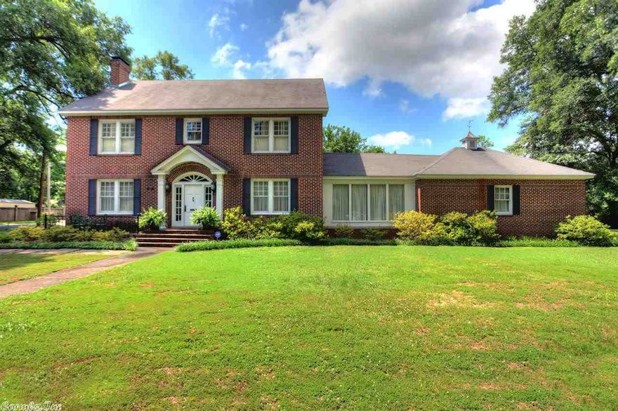 Classic Colonial home in Old Town Conway. Corner lot, big trees on over 1/2 acre. This beautiful 4 bedroom, 2.5 bath has a formal dining room, formal living room, and sun room. Downstairs has wood floors. Living room has wood burning FP, and den has a FP that uses gas briquettes. Kitchen has double ovens, Thermador electric stove with down draft vent. Patio area with small fence, garden spot, and rear entry two car garage. Storage building. Irrigation system around house perimeter See Disclosure for extras.