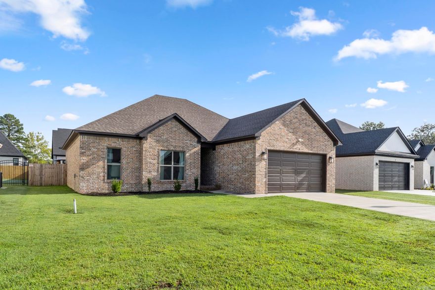 This 3 bedroom, 2 bath home is located in the beautiful East Meadows —Greenbrier’s newest subdivision! Built by Blakely Enterprises, this home offers a spacious split and open floor plan perfect for entertaining and relaxing. The thoughtfully designed kitchen features stainless steel appliances, custom cabinetry, tons of counter space, room for a small island if you desire, brushed champagne cabinet hardware, and a cozy dining area. Luxury vinyl plank flooring flows throughout the ENTIRE home. NO CARPET! The primary suite is dreamy with an oversized custom-tiled shower, double sinks, and 2 walk-in closets. This builder put so much thought into this floorplan including TWO ways to access the backyard - kitchen and across from the primary!  Enjoy outdoor living on the covered back porch, extended patio, and a FULLY FENCED backyard. Being only a little over a year old, it still looks and feels like a brand new home!