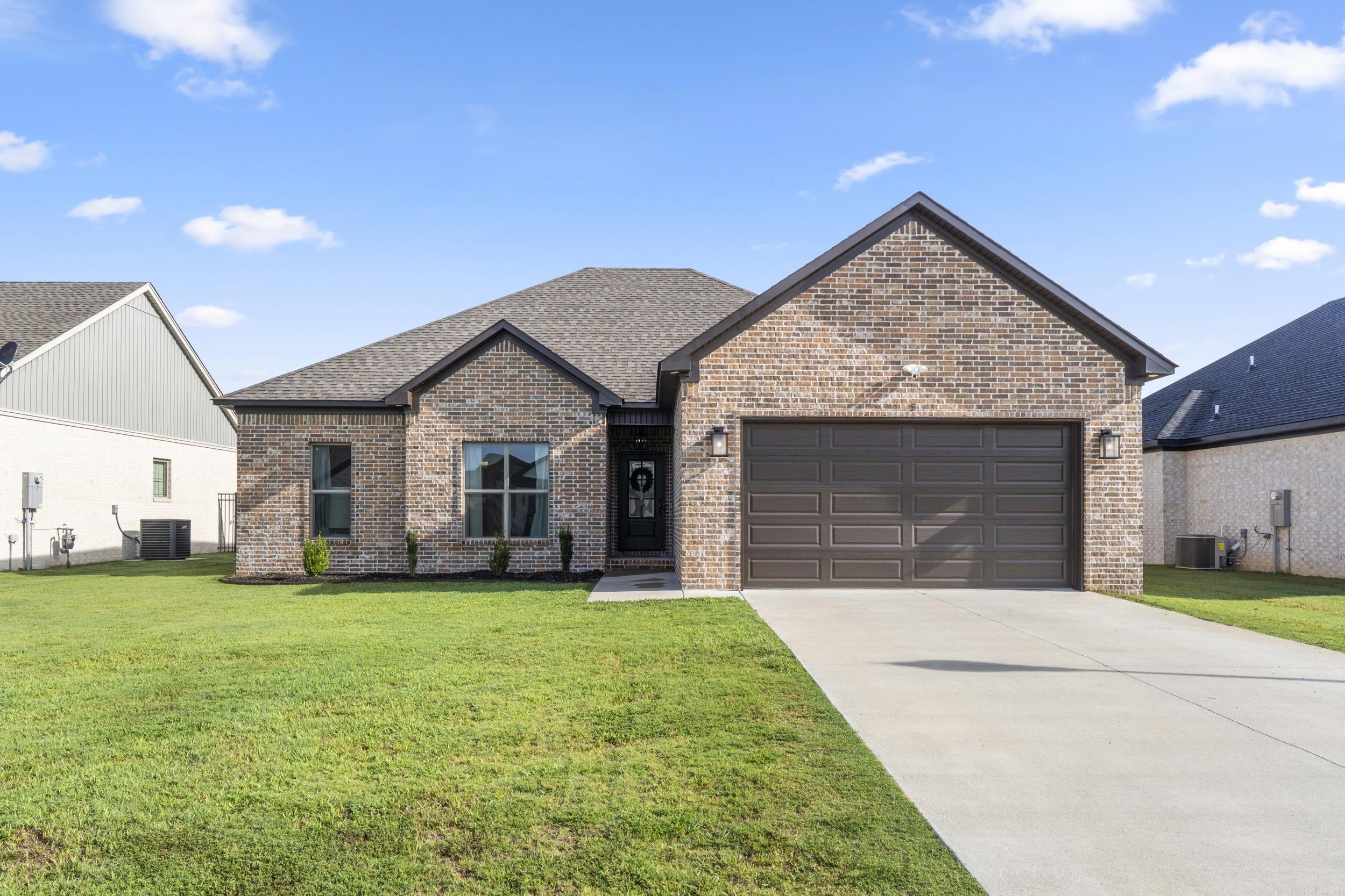 This 3 bedroom, 2 bath home is located in the beautiful East Meadows āGreenbrierās newest subdivision! Built by Blakely Enterprises, this home offers a spacious split and open floor plan perfect for entertaining and relaxing. The thoughtfully designed kitchen features stainless steel appliances, custom cabinetry, tons of counter space, room for a small island if you desire, brushed champagne cabinet hardware, and a cozy dining area. Luxury vinyl plank flooring flows throughout the ENTIRE home. NO CARPET! The primary suite is dreamy with an oversized custom-tiled shower, double sinks, and 2 walk-in closets. This builder put so much thought into this floorplan including TWO ways to access the backyard - kitchen and across from the primary! Enjoy outdoor living on the covered back porch, extended patio, and a FULLY FENCED backyard. Being only a little over a year old, it still looks and feels like a brand new home!