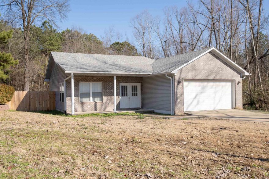 Beautiful 3 bed 2 bath open concept home. Efficient layout makes it feel roomy and it has great natural light throughout. New roof with architectural shingles in 2022. Many updates inside with a spacious lot that backs up to the woods and less than 5 minutes from the interstate makes this one to see!