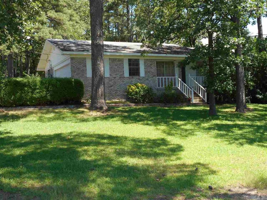 This three bedroom house is located in west Little Rock near Cantrell Rd., close to shopping, restaurants and major thoroughfares. It sits on a large tree-shaded lot in the Roberts school district. There are a two-car garage, a covered rear patio and plenty of storage with a basement and free standing storage buildings. Inside there are nicely finished hardwoods, , ceiling fans, and window coverings. The kitchen is furnished with refrigerator, electric rangetop, oven, microwave, and dishwasher.