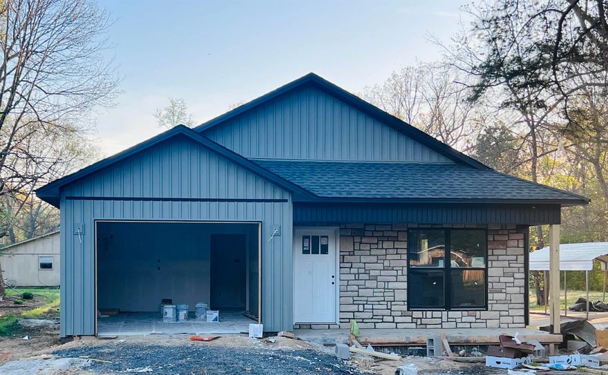 A stunning 1,435 sq. ft. residence that perfectly blends modern design with comfortable living. This thoughtfully designed property features three spacious bedrooms and two full baths, providing ample space for families or individuals seeking room to grow. As you enter, you'll be greeted by an inviting open living area that flows seamlessly into the kitchen, making it perfect for entertaining or spending quality time with loved ones. The kitchen boasts a stylish island and elegant granite countertops, enhancing both functionality and aesthetics. A convenient walk-in pantry offers plenty of storage for all your culinary essentials. The master suite is a true retreat, featuring a luxurious tiled shower and a roomy walk-in closet that provides excellent storage options. Additional bedrooms are versatile and can easily adapt to your needs, whether for family, guests, or a home office. Step outside to enjoy the covered back porch, ideal for morning coffee or relaxing evenings, all while overlooking your backyard space. Located in the charming town of Cabot, this home is conveniently situated near the high school, offering easy access to local amenities.