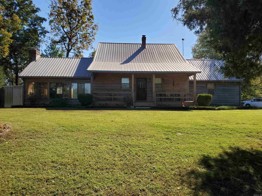 3460 CR 450 Piggott, AR will not last long!! This 3BR, 2BA, 2,048SQFT cabin style home is sitting on 1.5 acres right at the end of the pavement on CR 450! The beautiful craftsman style woodwork flows through out the house. Amazing views, peace and tranquility make this property a little piece of heaven on earth. A 24x30 shop, a 24x30 pole barn, a 20x20 metal carport and a 18x26 work shop make for great spaces for the guy who likes to piddle outside! This property is a must see!!!