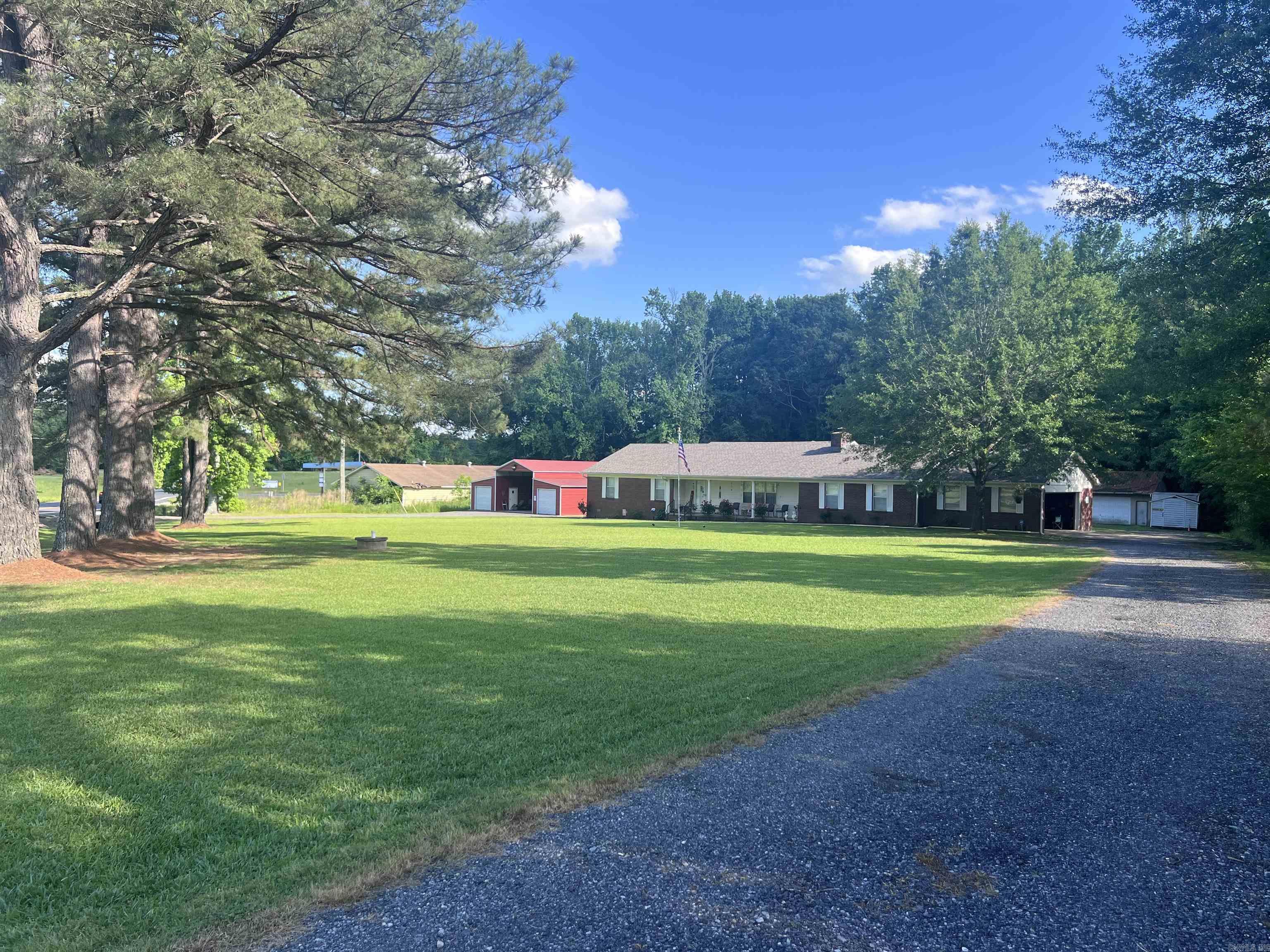 Welcome to this charming traditional home, offering a spacious layout and plenty of outdoor appeal on 1.89 acres of beautifully landscaped grounds. With 2,544 square feet of living space, this residence features three comfortable bedrooms and two well-appointed newly remodeled bathrooms, ideal for families or those seeking extra room. The heart of the home is the expansive family room, designed for relaxation and entertaining, while the sun porch invites natural light and offers a serene spot to enjoy your morning coffee or unwind after a long day. New HVAC 2020 and New roof 2022. In addition to the lovely home, you’ll find two well-equipped shops, perfect for hobbies or additional storage. The red shop measures 40 x 38 feet with a generous 12-foot clearance, perfect for RV’s while the white shop is 40 x 28 feet, both complete with electricity with its own meter to suit your needs. The spacious outdoor area is perfect for gardening, leisure activities, or simply enjoying the tranquility of country living. This property truly combines comfort and functionality, making it a wonderful place to call home. See Agent remarks