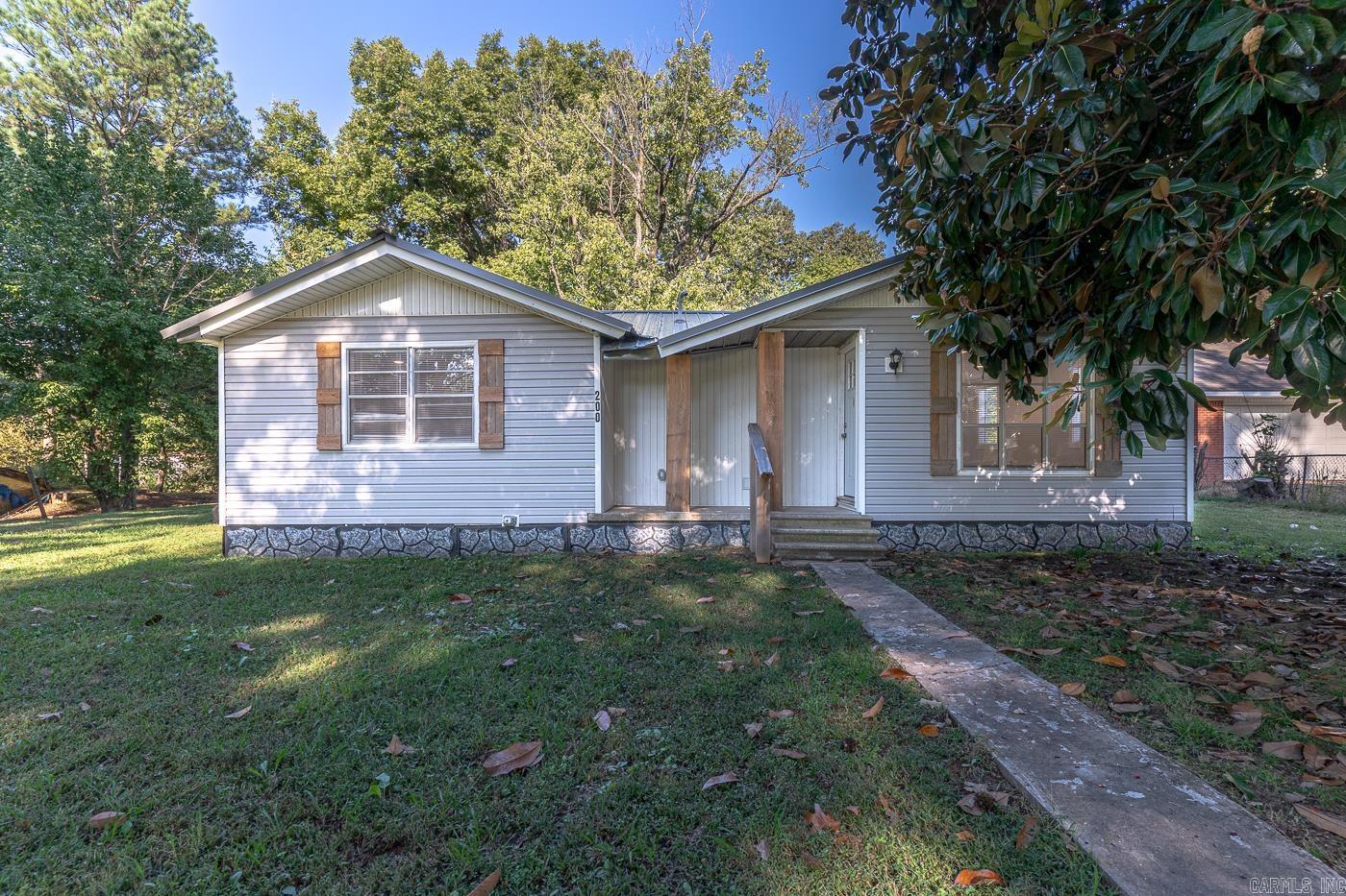 Welcome to Market 200 Church Street of Brookland, Arkansas within the Brookland School District. Situated on a level 1 +/- acre level lot sprinkled with shade trees is a renovated Ranchette, wrapped in vinyl, topped with a metal roof, and accented by shutters, wood posts, and a charming front porch. The interior features 854 sf of well laid out living space that contains 2 bedrooms, 1 bathroom, an open concept living/dining/kitchen area, and laundry room. You'll love the contemporary color palette, stainless steel appliances, tankless water heater, and storm shelter. Per the Sellers the house was completely remodeled with subfloor, flooring, sheetrock, paint, trim, light and electrical fixtures, roof, interior and exterior doors, insulation, cabinets, granite countertops, HVAC, and water heater. Conveniently located near favorite local amenities with easy access to US 49 N. Call today to schedule your tour and make this house your home or next addition to your rental portfolio.