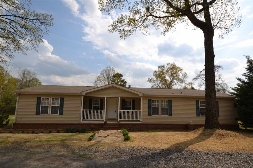 Beautiful~Secluded~Private country setting w/key pad code security gate~If your wanting wildlife to hunt right outside your door than this is it~This home has 11.22 acres, a spring fed stocked pond w/Bass,Catfish,Bream,Crappie & a  Dock~20x30 metal barn w/3 horse stalls & tack rm & dog run~All metal, fully insulated 2-car garage w/storage overhead & a 10x25 shop w/electricity attached to back of garage~CITY WATER~1,000 gal septic tank to the east of home~RV parking w/30 amp breaker~sqft approx,measure