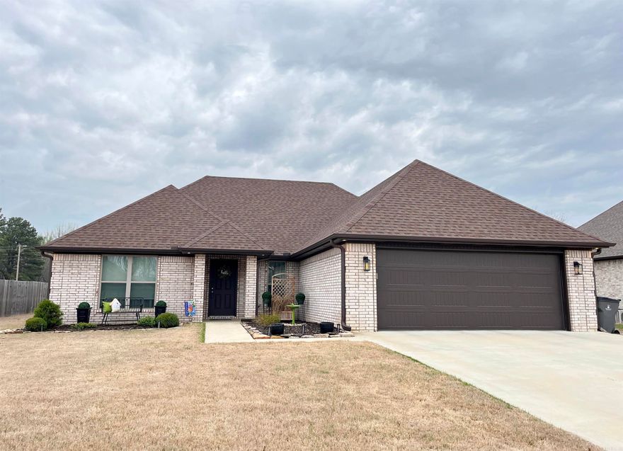 Don't miss this immaculate 3 Br 2 bath brick home!  The home has 1640 sq ft, split bedrooms, open floor plan, laundry room, large pantry, LVP throughout and beautiful finishes. The large open living area with 10 ft ceilings, kitchen and dining area make up the center of the home. The kitchen features granite countertops, stainless appliances, and large bar with seating. The primary bedroom has a step ceiling, walk in closet and attached bath with a stand alone tub, two separate vanities, walk in shower and linen closet. There is a small covered porch, two car garage, and a patio at the back perfect for grilling! See agent remarks.