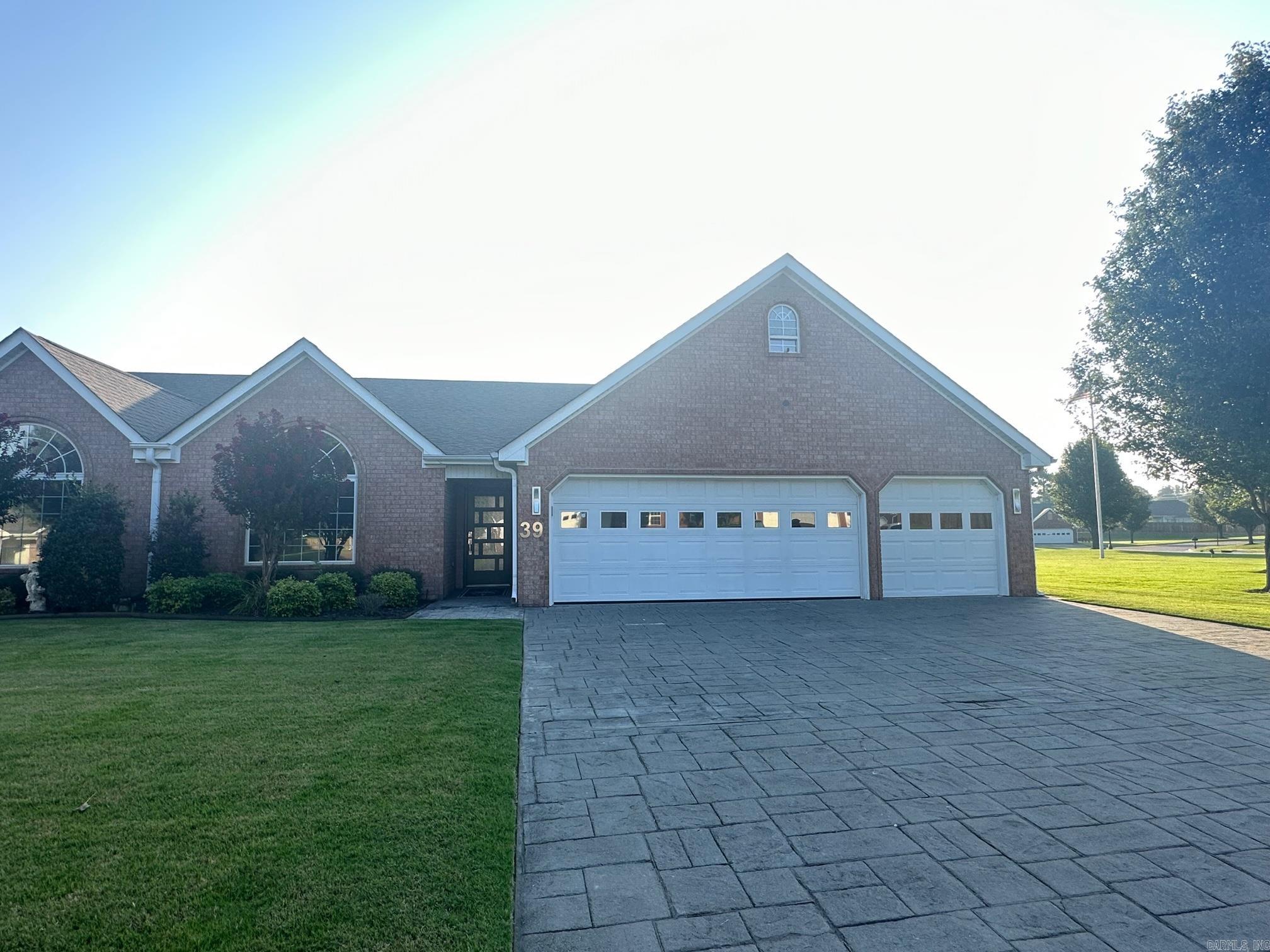 Totally remodeled and three car garage on the pond, around 1700 sf of living space, built ins, bar and quartz waterfall countertops, large steam shower in primary suite, open floor plan, lots of storage, excellent location, with large patio sold before listed