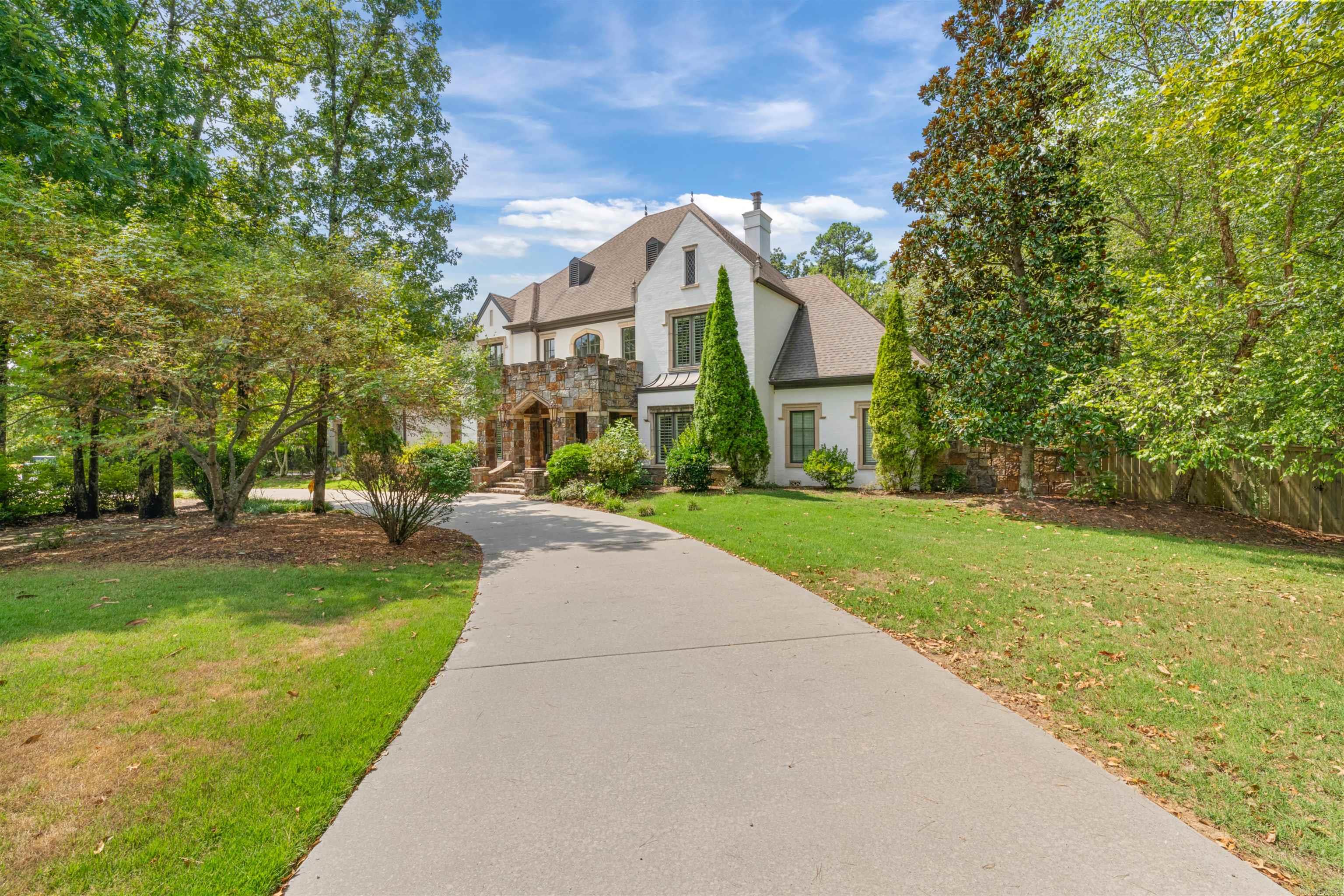 Privacy at its finest in the prestigious gated community of Sologne. This exceptional estate blends traditional elegance with everyday comfort, offering generous space for both family and entertaining. The main level features a chef’s kitchen with gas cooktop, double ovens, two dishwashers, microwave, large island, walk-in pantry, and coveted Sonic ice machine. A formal dining room, office, hearth room, formal living, and the luxurious primary suite complete the first floor. Upstairs, four bedrooms, three full baths, and two versatile bonus rooms provide space for all, along with extensive walk-out attic storage. Outdoor living is unmatched with a sparkling pool, hot tub, play set, and lush greenspace provides privacy. A three-car side-loading garage with new doors and oversized storage completes the home. Located in the heart of Chenal, just minutes from top schools, golf, dining, and outdoor recreation—this is Little Rock luxury living at its best.