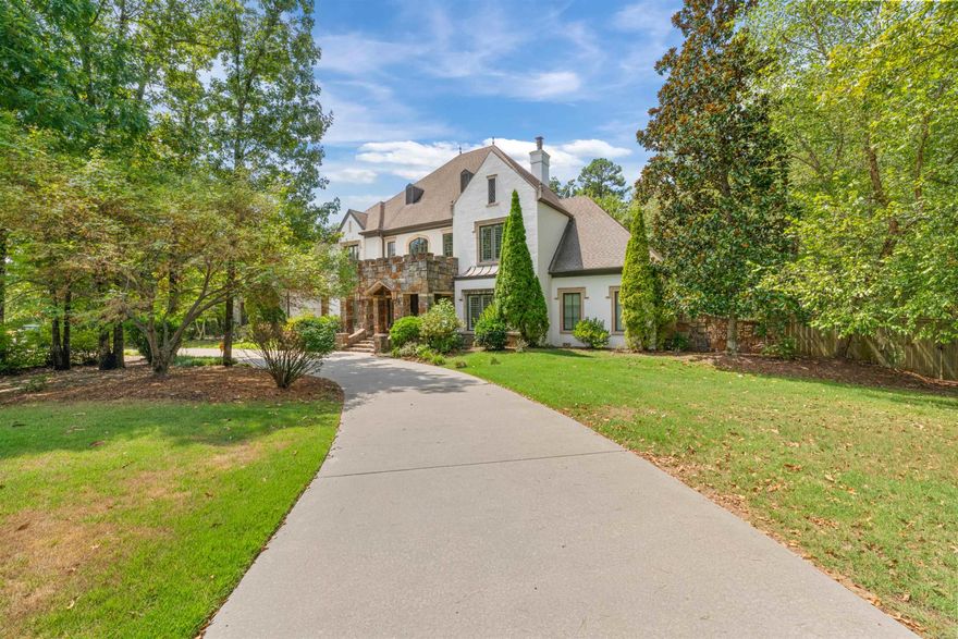 Privacy at its finest in the prestigious gated community of Sologne. This exceptional estate blends traditional elegance with everyday comfort, offering generous space for both family and entertaining. The main level features a chef’s kitchen with gas cooktop, double ovens, two dishwashers, microwave, large island, walk-in pantry, and coveted Sonic ice machine. A formal dining room, office, hearth room, formal living, and the luxurious primary suite complete the first floor. Upstairs, four bedrooms, three full baths, and two versatile bonus rooms provide space for all, along with extensive walk-out attic storage. Outdoor living is unmatched with a sparkling pool, hot tub, play set, and lush greenspace provides privacy. A three-car side-loading garage with new doors and oversized storage completes the home. Located in the heart of Chenal, just minutes from top schools, golf, dining, and outdoor recreation—this is Little Rock luxury living at its best.