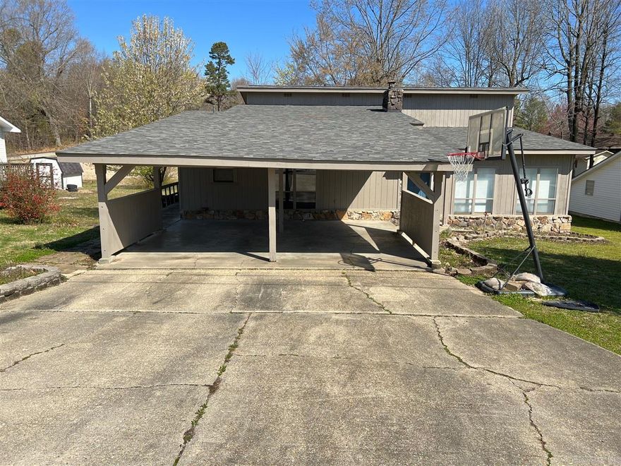 You better hurry....It's priced at ONLY $169,000. I know you will want to see this 3/4 bedroom, 2 1/2 bath home with over 2500 sq ft. This home has character and charm. The living area has vaulted ceilings, wood beams, and gas stone fireplace. The kitchen is open to the dining room. There's a built in banquet table in the breakfast nook, and there's a large kitchen island and pantry closet. The stainless steel appliances convey and are approximately 2 years old. The master bedroom is huge, with two closets, and has an ensuite bathroom with double vanities. There is access to the deck area off master bedroom. Imagine hanging out on the deck enjoying your morning coffee, or relaxing in the evening. There is an additional bedroom and bath upstairs, as well as two additional rooms off the living area, which has access to the backyard. There's a storage building which offers an abundance of storage space. Let's get you into your new home before summer! Don't wait call today !