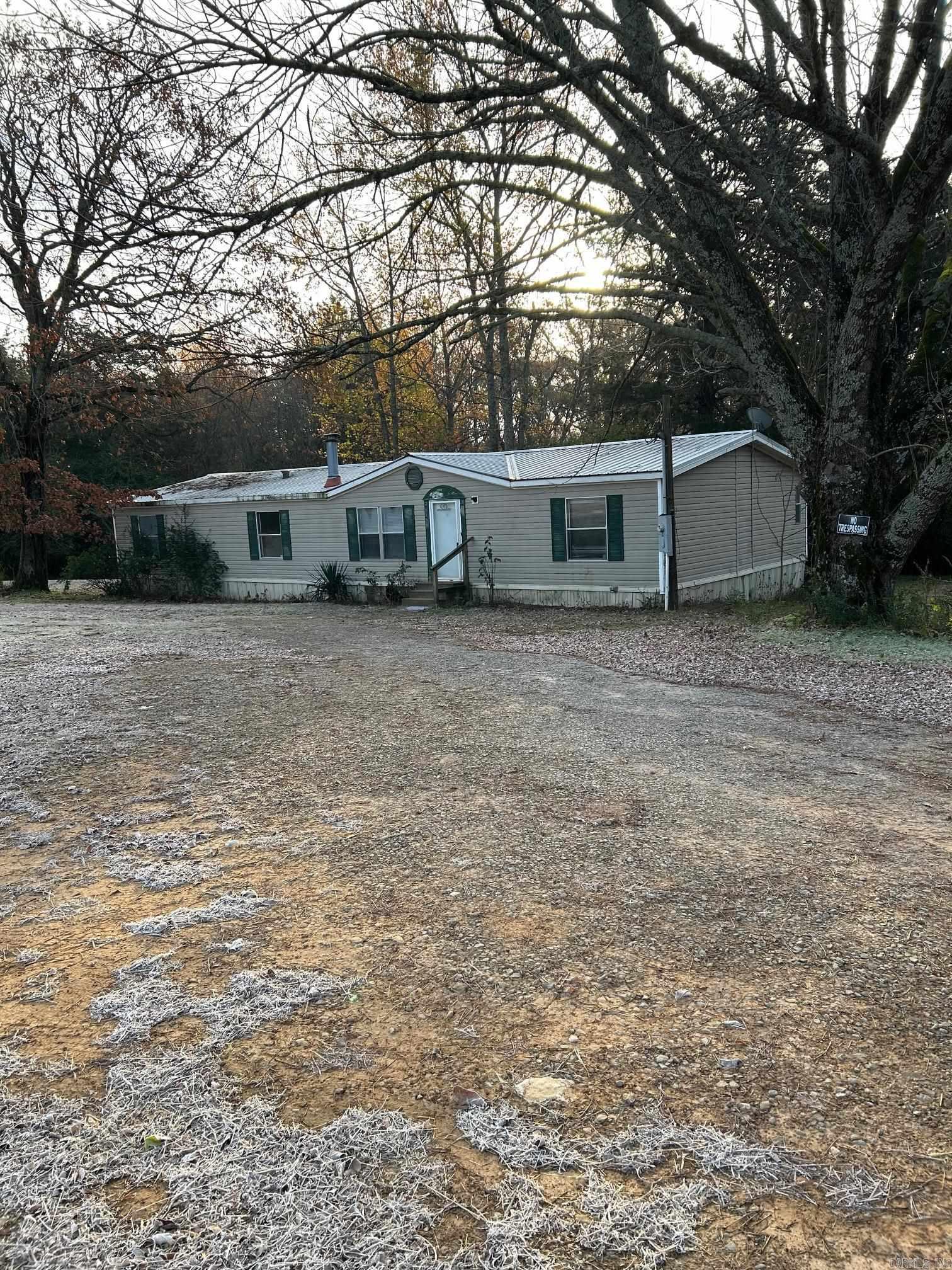 Larger double wide sold as is on approximately 2 acres.  Has 2 living areas and could be 4th bedroom, fireplace, circle drive, island in the kitchen, pantry, walk in shower with soaking tub in master bath, walk in closet.  Laundry room, vaulted ceilings.  Metal roof was replaced .   Condition of property not known by seller.