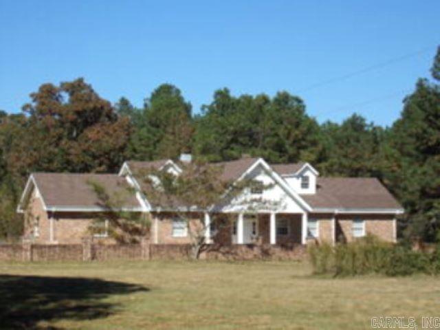 This charming country home has so much character and so many possibilities!! Situated on 13.93 acres, this New Orleans style home features high ceilings throughout, it has 4 bedrooms, 3 full bathrooms, 2 living rooms, both with fireplaces, an enormous kitchen, and so much more. Updates: central heat/air unit replaced in 2008, double pane windows, underground drains installed for rain gutters.