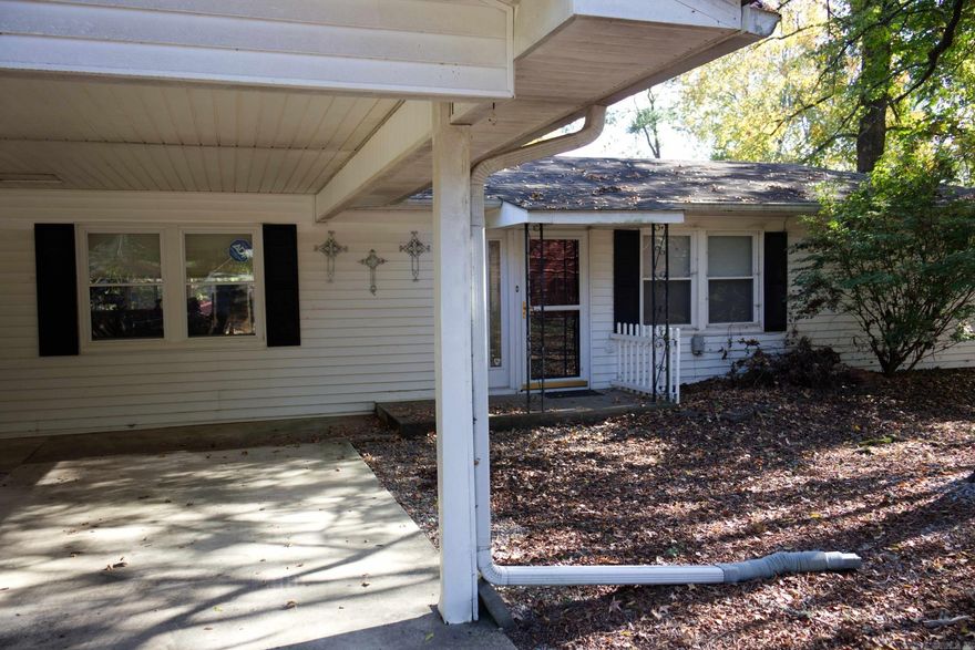 Welcome to the LAKE! Amenities abound with this 3 Bedroom 2 Bath lakefront home. Walk out onto your level lake oasis with ample entertaining areas including a lakeside concreted and covered pavilion and screened-in outdoor space beside the home. The property has an insulated, heated and cooled two car shop which adjoins the covered boat dock with two remote controlled boat lifts.  This amazing property also includes a greenhouse, a workshop,  a covered RV carport with 50 Amp hookup and much more!  Convenient location.  Close to town and all amenities yet has a relaxed, oasis feel.  A must see!!  Call today to see this fisherman’s dream!