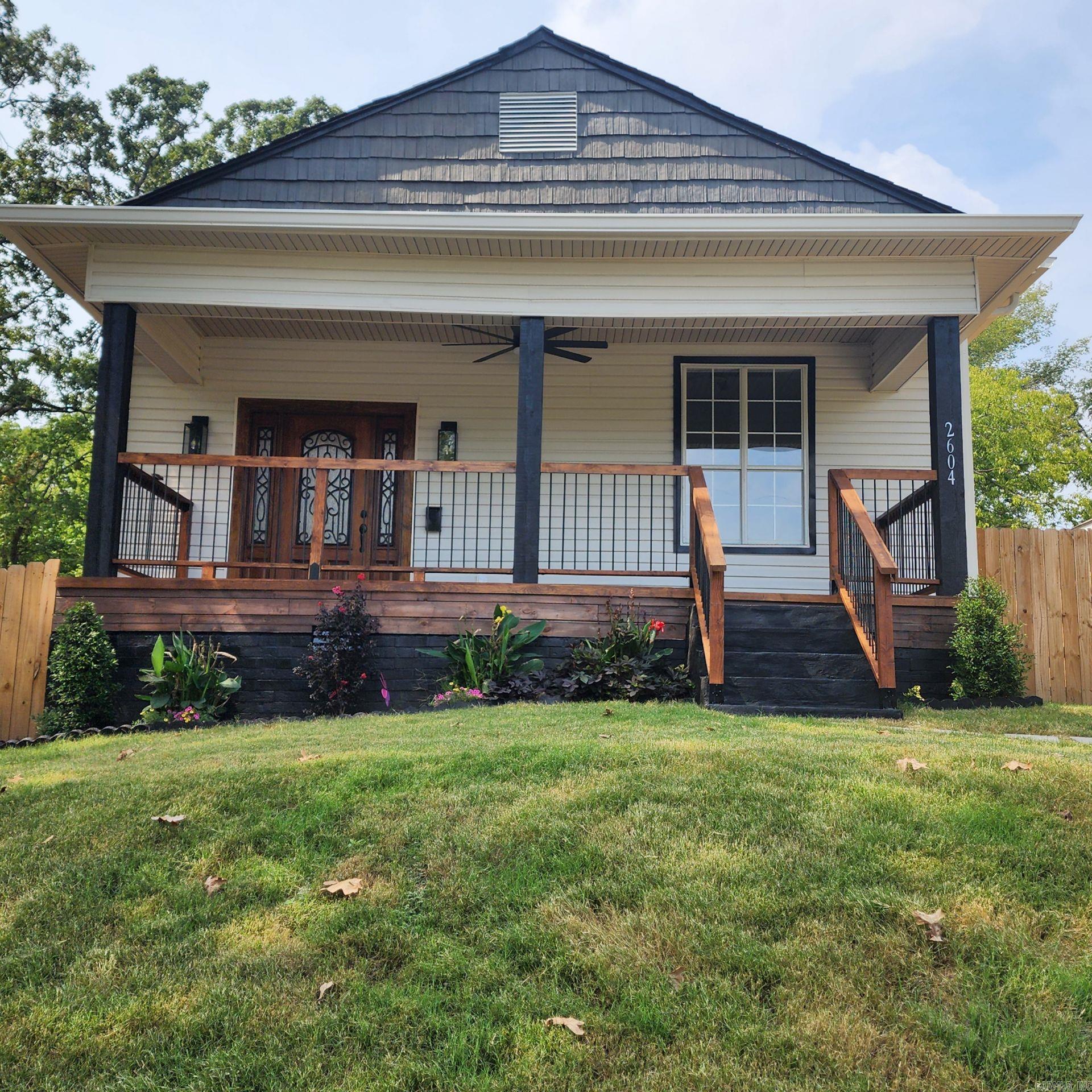 This custom remodeled home has all the luxuries and features of a New Construction. Home was taken to the studs & rebuilt. This stunning completely renovated home is combined with elegance and vintage and sits in a prime location just minutes from downtown. The large covered porch is perfect for relaxation. The open floor plan displays a LED electric fireplace in the living area & recess lighting throughout the house. Kitchen features Quartz countertops, Beautiful white custom cabinetry with a Lazy Susan Turntable, Coffee Bar & Stainless-steel appliances with an Over the Range Convection Microwave. Refrigerator conveys. The primary bedroom features a walk-in closet, full bathroom with a custom walk-in shower & LED vanity mirror. Primary bedroom has its own private entry that leads to the back deck to sit & enjoy the beautiful landscaping & privacy fenced backyard. Storage building conveys. Light fixtures & ceiling fans 2025, Waterproof LVP flooring 2025, Electrical 2025, Plumbing 2025, Water Heater 2025, HVAC 2025, Gutters 2025, Roof 2025, Sod 2025. This home was built in 1959 but has all the high end features of a new construction. Schedule your private showing today & be amazed!!