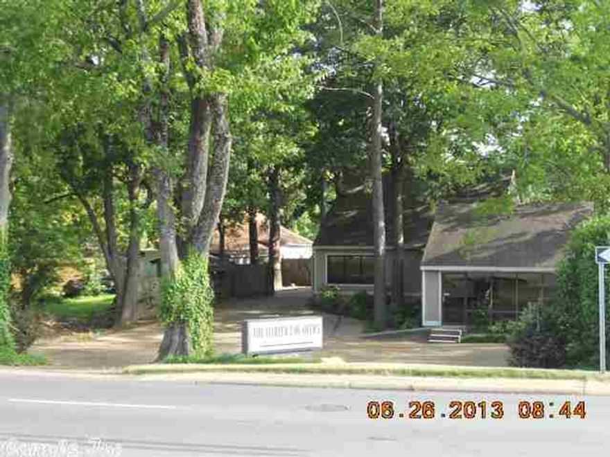 Great space for lawyer, accountant or other professional. Reception area, conference room, office with woodburning fireplace and separate entrance. PLUS 2 bedroom living 1 bath living quarters upstairs. Privacy fence in rear with a covered patio. 9 parking places, landscaped, on high traffice site. Comes with phones and mutiline system.