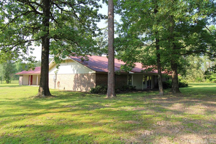 4 acres with brick home*this land is gorgeous*3 big bedrooms*2 full baths-one bath is a Jack and Jill*the metal roof is around 9 years old*HVAC only 5 years old*large kitchen with plenty of counter space and cabinets*huge tile shower will accommodate a wheelchair*fireplace place with floor to ceiling brick*2 water heaters*living room has a beamed vaulted ceiling*3 car carport*pole barn is 32x72 has metal trusses and metal wall supports*also pole barn has concrete floor throughout*new survey*bring your kids and animals*Sheridan Schools*please call me about the location of septic tank*