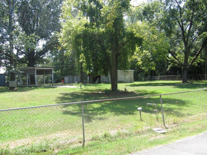 Just rezoned and approved for mobile homes.. This is a Residential lot perfect for building that new home or mobile home. It has several sheds and RV covered parking. There are city utilities on the property including city water and city sewer.