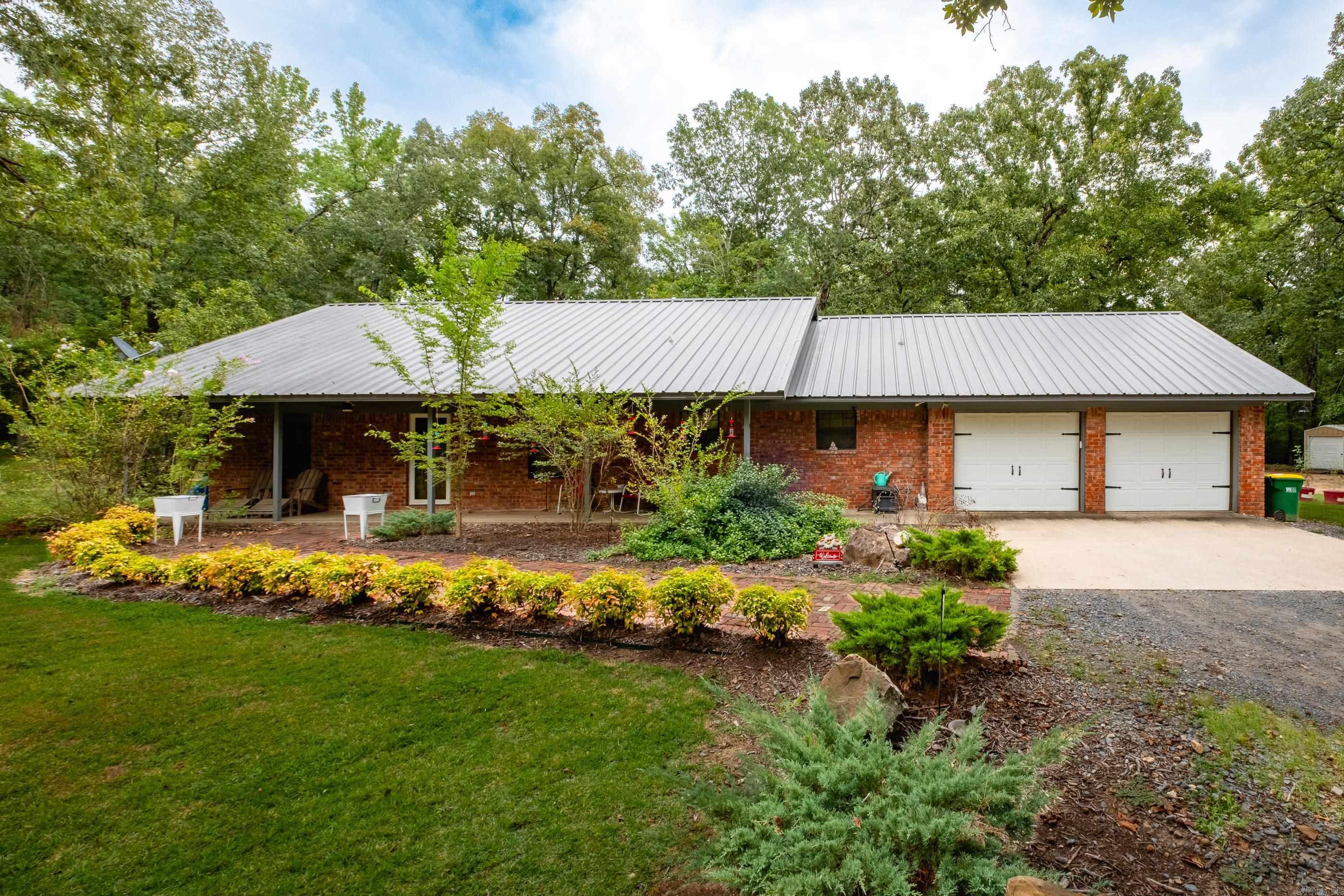 Tucked away on 5 private acres, this charming home offers the perfect blend of seclusion and convenienceājust outside the city, yet surrounded by peace, wildlife, and nature. The gated entrance opens to flat, usable land offering endless possibilitiesāwhether for expansion, recreation, or privacy. This one level home has a primary suite that is separate and spacious w/sitting area or office space and a walk-in closet. Thereās a two car garage and storage room plus a large laundry room with mud room entrance from garage. Outdoor living with covered front and back porches, a built-in grill kitchen area, and a playground. Deer often wander right into the backyard, adding to the propertyās natural beauty and serenity. More features include a new HVAC system, a durable metal roof (<10 years old), a large shop for storage or hobbies, and a brand-new well and well house. This property offers room to breathe, space to grow, and the comfort of country livingāall while being just minutes from town!