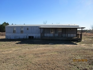 This property has potential, large lot, outside storage, etc.. Owner will finance to qualified buyer.