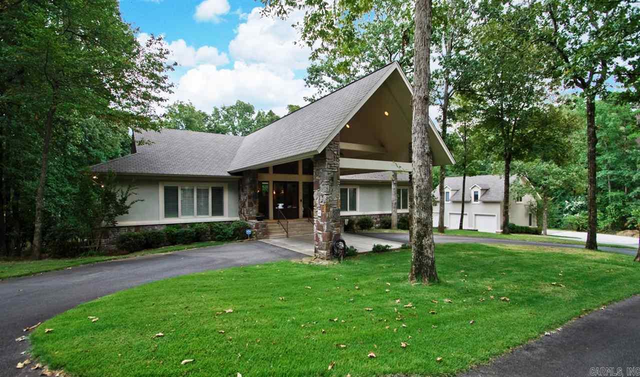 Spectacular architecture located on one of the largest golf course lots in Chenal! Blt by Jack Hartsell this custom designed hm features every amenity. Handsome portico and foyer welcomes you into spacious home w/ limestone and hrdwd floors. 3 fireplaces. Wonderful stonework & vaulted ceilings. Phenomenal chef's kit w/ breakfast room and veranda overlooks magnificent resort styled pool and Private grounds. Master and guest main. Carriage house(sf not incl.)has large living w/ bed & bath+1/2. 4 car gar+golf