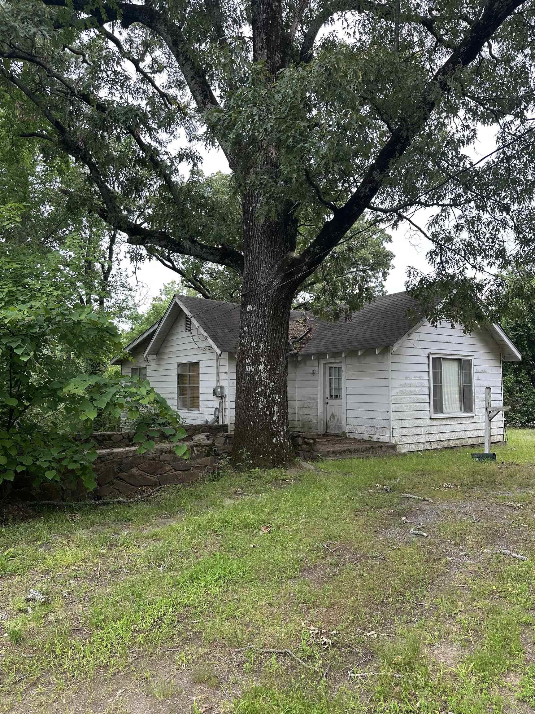 Investment property-1920's home. Utilities are turned off. Home needs work-Sold AS-IS present condition at closing. Land goes beyond the back fence line.