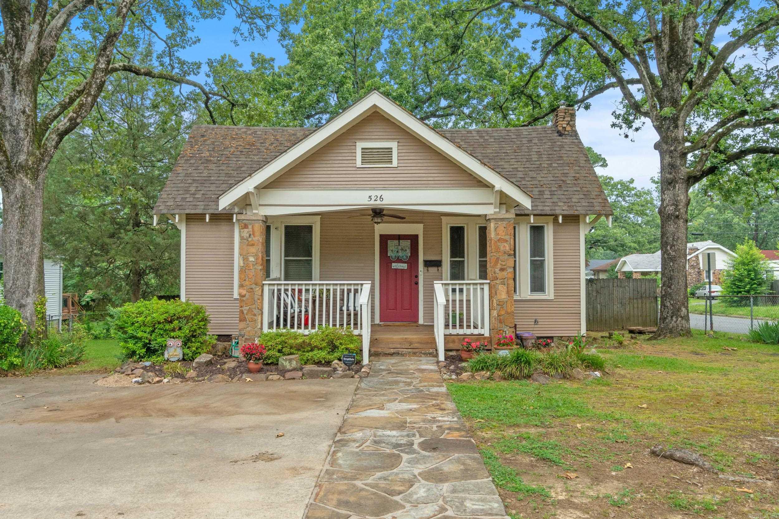 Charming Craftsman in the Heart of Hillcrest! Welcome to this beautifully maintained Craftsman-style home in the desirable Hillcrest neighborhood! Offering 1,796 sq. ft. of living space plus a 234 sq. ft. loft, this 3-bedroom, 2-bath home perfectly combines timeless character with modern updates. Step onto the spacious covered front porch and into a warm and inviting living room featuring a cozy wood stove. The primary suite is a true retreat, with vaulted ceilings, generous natural light, a private covered deck, and an upstairs loft—ideal for a home office, reading nook, or creative space. Additional highlights include a separate dining room, laundry room, and a fully fenced backyard with a storage building—perfect for pets, gardening, or outdoor gatherings. Don’t miss this rare opportunity to own a piece of Hillcrest charm. Schedule your showing today!