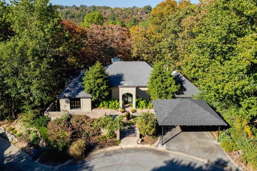 Private and secluded, this beautiful home sits on an awesome cul-de-sac in Robinwood. Two-car carport and low maintenance yard w courtyard and water feature. Beautiful French doors open to Living Room w fireplace and 11-foot ceilings. Custom kitchen cabinets, granite countertops and eat-in breakfast room overlooking private backyard. Lives like a one level with ensuite primary bedroom on main level and den and guest quarters downstairs. It is in great condition and backs up to green belt. Perfect for single, couple, or family w college student. Such a lovely home in a beautiful setting.