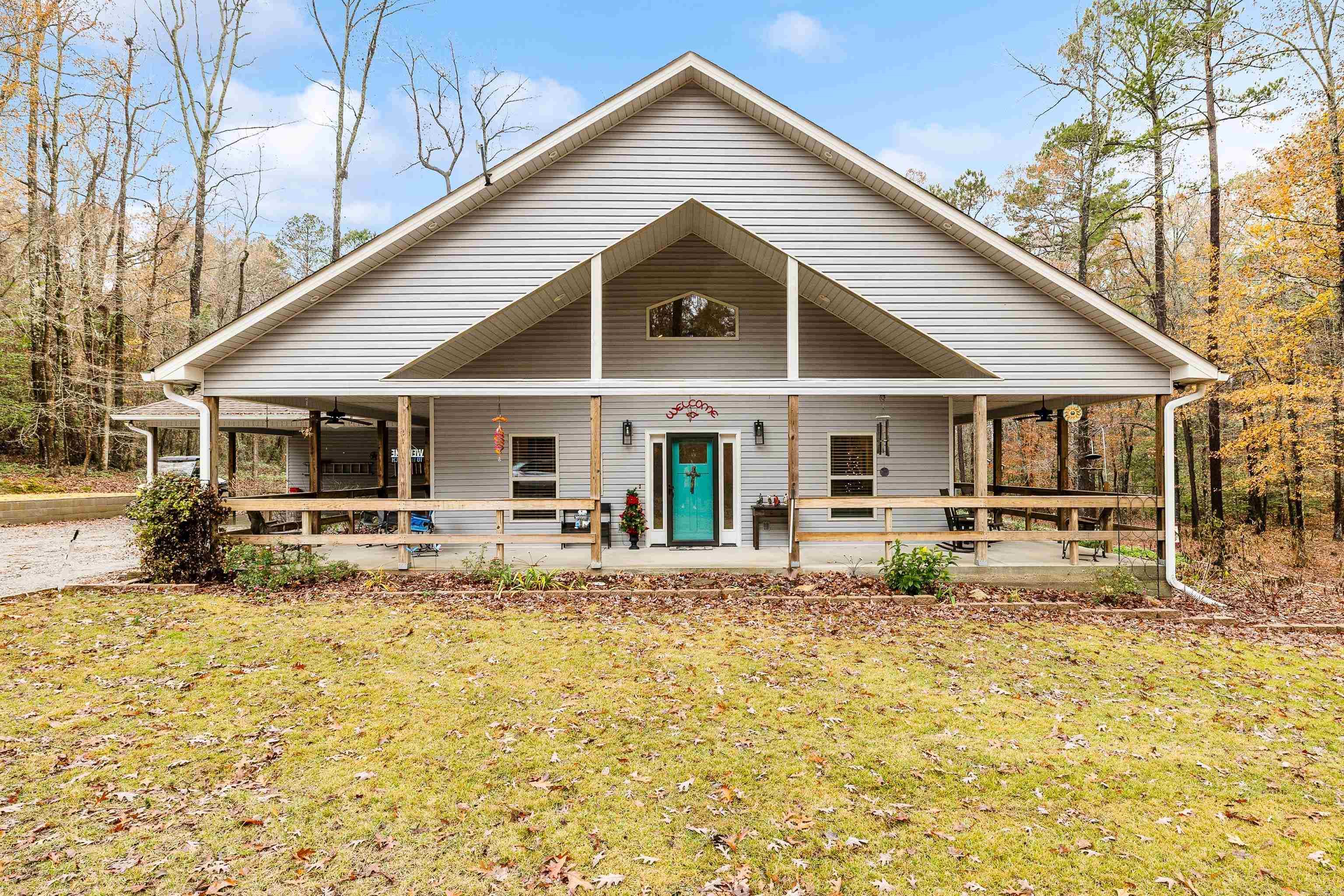 Don't miss this one!! Are you looking for peace and privacy? This custom and well maintained home sits on 3.40 acres, just outside the city of Benton (towards Bauxite). There is plenty of space to sit on the 8 foot wrap around porches, enjoying the scenery and wildlife. A small creek runs through the back of the property line. As you walk inside, you are greeted with an open, spacious kitchen, living, and dining room combo with tall ceilings and picture windows. This home offers a large primary bedroom and bath. Primary bath has a large walk-in shower and walk-in bath. Just outside the primary bedroom is a huge walk-in closet (was meant to be a bedroom). Across the hall from the closet is a large office space or bedroom. Every inch of this home is usable space with tons of storage. Upstairs is a huge loft type room with a large walk-in closet. Ample storage in attic as well. Large laundry room with pantry and plenty of room for an additional refrigerator or freezer. You honestly have to just see it!!! Whole home generator conveys. 2 outdoor storage spaces off the carport. Agents see remarks!