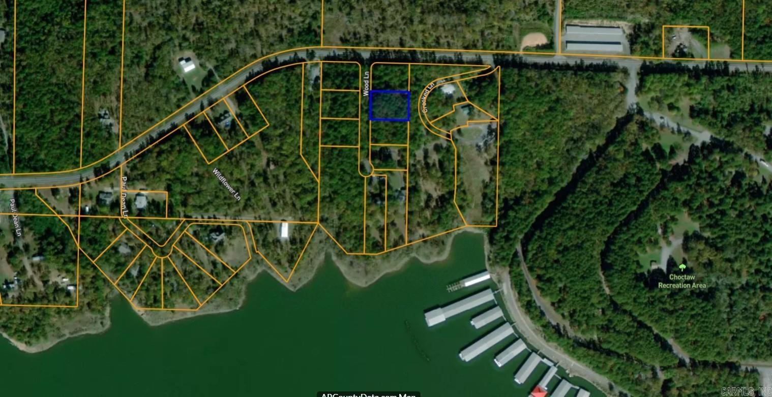 Cleared, leveled, and ready to build! This prime lot near Greers Ferry Lake features a completed perc test, established driveway, utilities at the street, and finished dirt work. Located in Woodland Shores, just minutes from lake access—bring your builder and start right away!