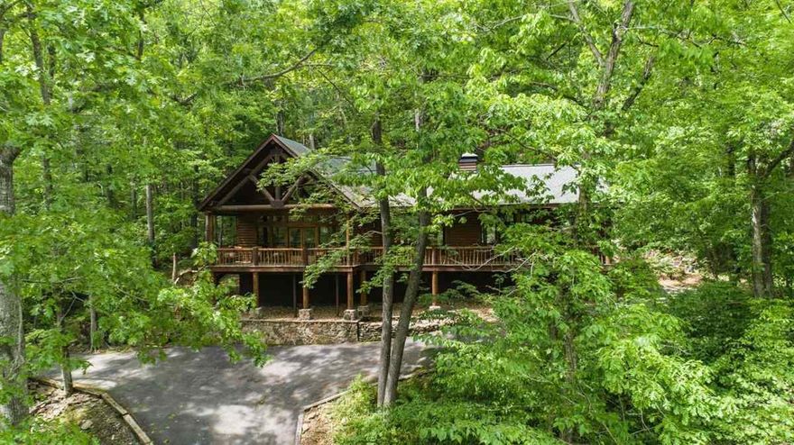 Furnished, one of a kind Riverfront 4 BR,3 BA log cabin has 2 stall boat dock with extended fishing platform. Gated ,located at end of S/D.  42 acre Nature Conservancy across the river to protect the natural river views.  Surrounded on N & W by 113 private acres.  Remodeled in 2006 with quality materials, two fireplaces, Screened porch off Master BR & Master Sitting Room to enjoy the soothing water feature.  Hugh natural rock fire pit in back. Much More..For additional info see Associated Docs and videos.