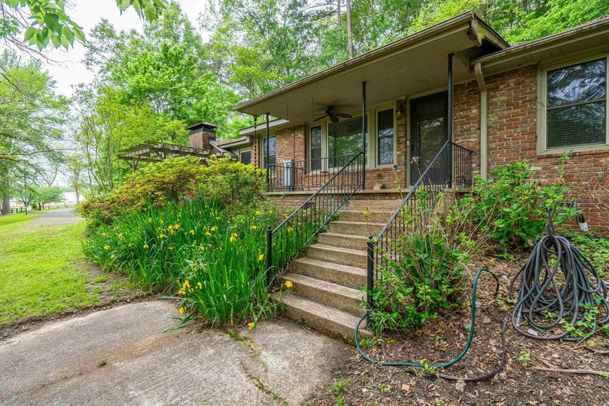 Hidden gem in secluded location! This 3 bedroom 2 bath home with updated kitchen, heated floors in master bath, encapsulated crawlspace and large workshop.  Beautiful home nestled in on a quiet street with mature trees facing the Ouachita River.  Fall and winter river views from front porch and living room.  Steps away from the Ouachita Baptist University campus and walking trail that ends at the Ouachita River.