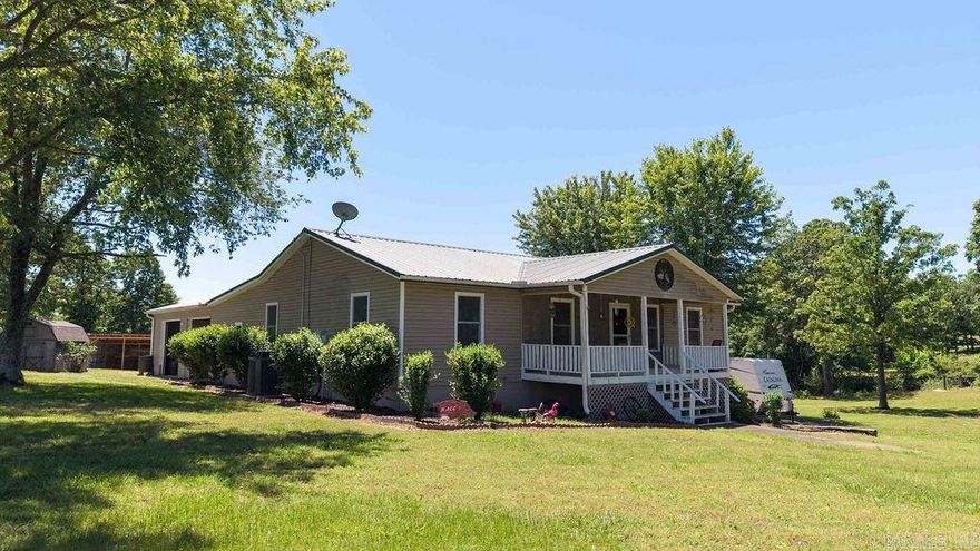 As you drive down the gravel driveway you come upon a charming country home that is nestled on 10.41 acres and immediately feel the peacefulness as you see the welcoming front porch and take in the countryside around you.  If you love the outdoors this property offers a pond, a garden site, implement shed with solar panels, cross fenced, fruit trees, 2 shops with plenty of room to expand, a place for your camper and plenty of room to hunt. The house boasts a large all seasons screened porch, a hot tub, an above ground pool with deck, large garage, wood stove along with central heat & air, heated flooring in primary bath, and a den for hanging out with family.   This one checks so many boxes!!!!