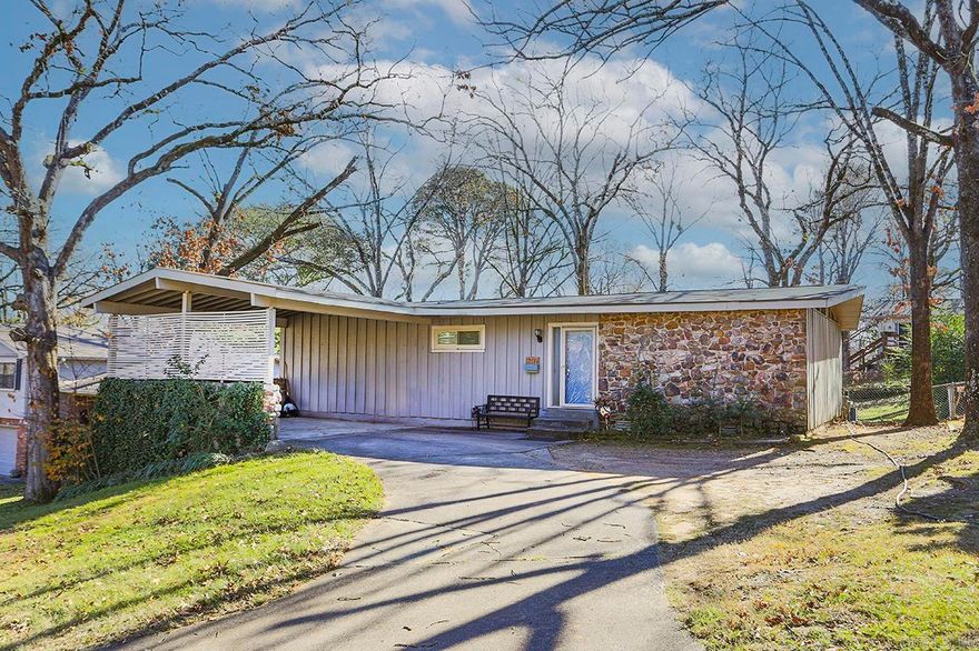 Beautifully maintained mid-century style gem offering space, style, and a convenient location! Inside, you’ll find 5 bedrooms, 3 full bathrooms, newer wood floors, vaulted ceilings in the living room, an abundance of natural light throughout. Main level features inviting living and dining spaces, updated kitchen, primary suite with updated en-suite bath, plus two additional guest rooms (one currently used as an office) and hall bath. Downstairs living area offers incredible flexibility with second living space, two more bedrooms (one, not pictured, currently used for storage), large laundry room with sink and folding counter, access to the backyard—perfect for guests, in-laws, or roommate setup. Step outside to huge backyard and patio, ideal for relaxing or entertaining. Outside storage room, updated windows, carport, immaculately kept. This is a rare find, don't miss the chance to call it your own!