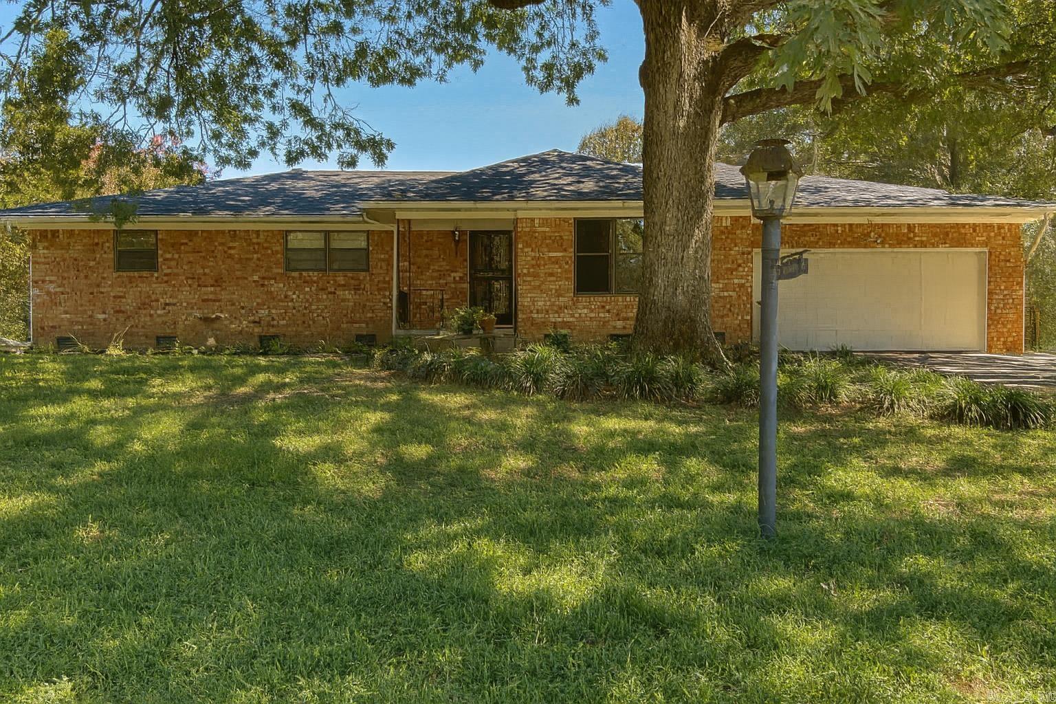 Welcome to this fantastic all-brick residence in Talmage Forest neighborhood. Recent updates mean new owners can move in with peace of mind, as major items have already been addressed. This home boasts a newly installed roof and brand-new HVAC system, ensuring comfort & reliability from day one. The den/dining & kitchen feature new tile flooring while the separate living area & rest of the home retains its original hardwood floors blending contemporary style with timeless character. Step outside to enjoy the lovely screened-in back patio, perfect for entertaining or relaxing. Adjacent to the patio, a separate grilling & sitting area adds flexibility for gatherings & cookouts. The fenced yard is ideal for pets and single car garage adds an extra layer of convenience to this very appealing property. Schedule your showing today to experience all this wonderful home has to offer!