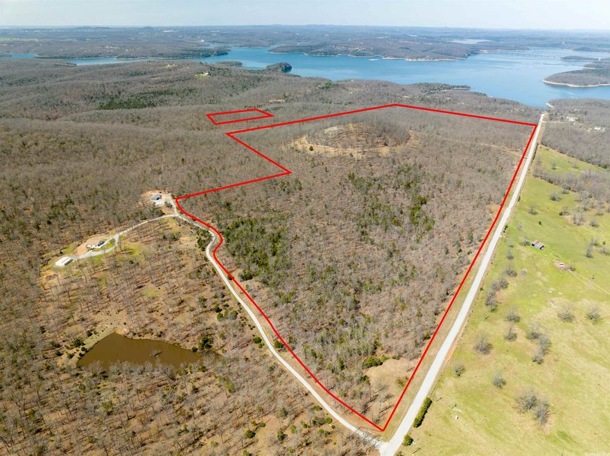 This is the one if your'e looking for JAW DROPPING views of Lake Norfork. It's absolutely the best view of the Major parts of Lake Norfork that is available today. You can see the Dam as well as Both Bridges on top of Flint Knob. What's even better is the access is paved with a grand, gated entrance, fantastic perimeter fencing and incredible roads all through the 168 acres. Did I mention a private boat dock with 7 slips? This property just goes on and on. Previously planned and surveyed to be a private retreat with condominiums slated on top of Flint Knob, it has never been developed and is waiting for your ideas. Trust me this is ''The Best View on Lake Norfork'' You will not be disappointed.
