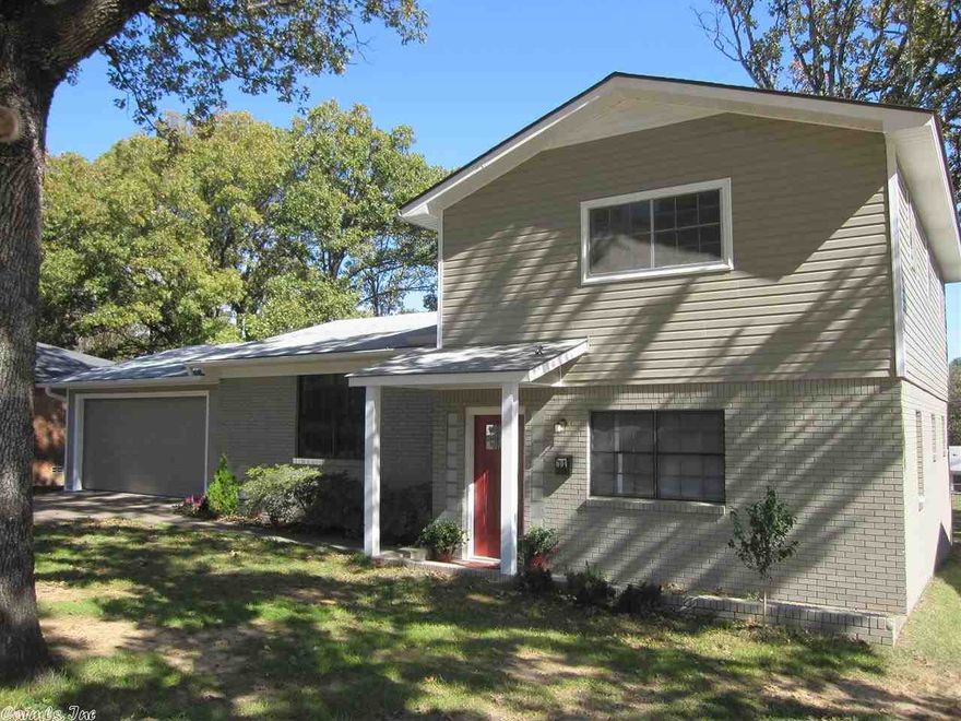 This home has been totally updated but has that retro feel . New Heat and Air new light fixtures, new carpet in the master bedroom. New garage door with opener, tons of storage. Master bedroom is down . Seperate living area with a gas fireplace. Hardrwood floors in the living room and the bedrooms up staires. New cabinets and counter tops new applainces. L.arge back yard. Measuring is encouraged.