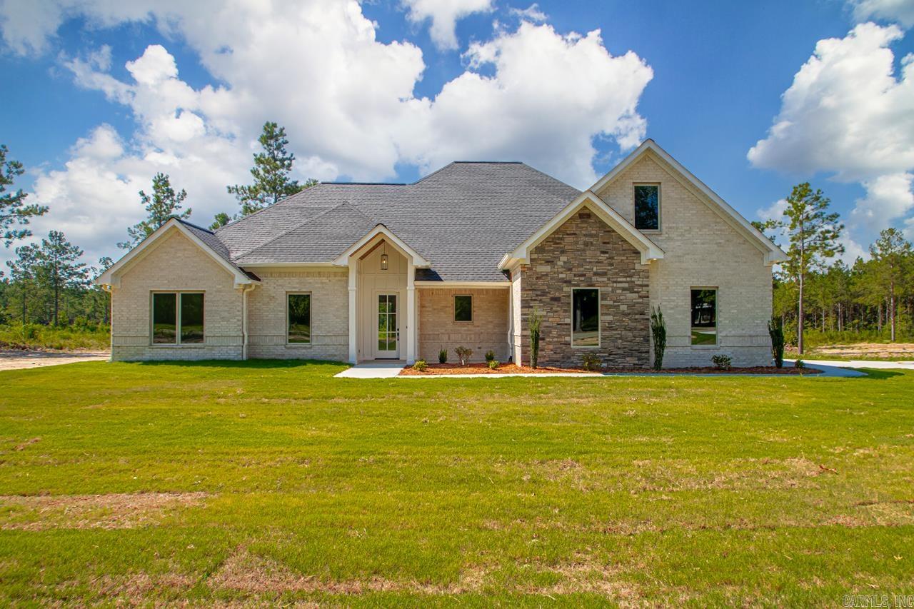 NEW SUBDIVISION IN EAST END COMMUNITY!!! Drake Trail Estates.....Are you looking for easy access to the freeway? Only 20 min to downtown Little Rock. This is a perfect location and great school district as well as community. This home features 4 main bedrooms downstairs, one could be an office. Bonus room upstairs with a nice closet or could be used as a 5th bedroom if needed. No carpet. As you walk into the entry way you are greeted with an open area showing off a beautiful gas log fireplace, open to large customized kitchen, lots of cabinets and huge walk in pantry. The kitchen has a gas stove with wall microwave and oven. Stainless steel appliances. Quartz countertops and custom painted cabinets. The primary bedroom is split plan from other rooms. The primary bathroom is large with a custom tile shower, separate vanities, soak tub. The primary closet is huge with lots of built in dresser space. Exterior is all brick with a small amount of hardie board to give the perfect curb appeal. The front porch is perfect for those rocking chairs and the covered back porch will be great for grilling out with a super large yard. Plenty of space for that shop and pool to be added.