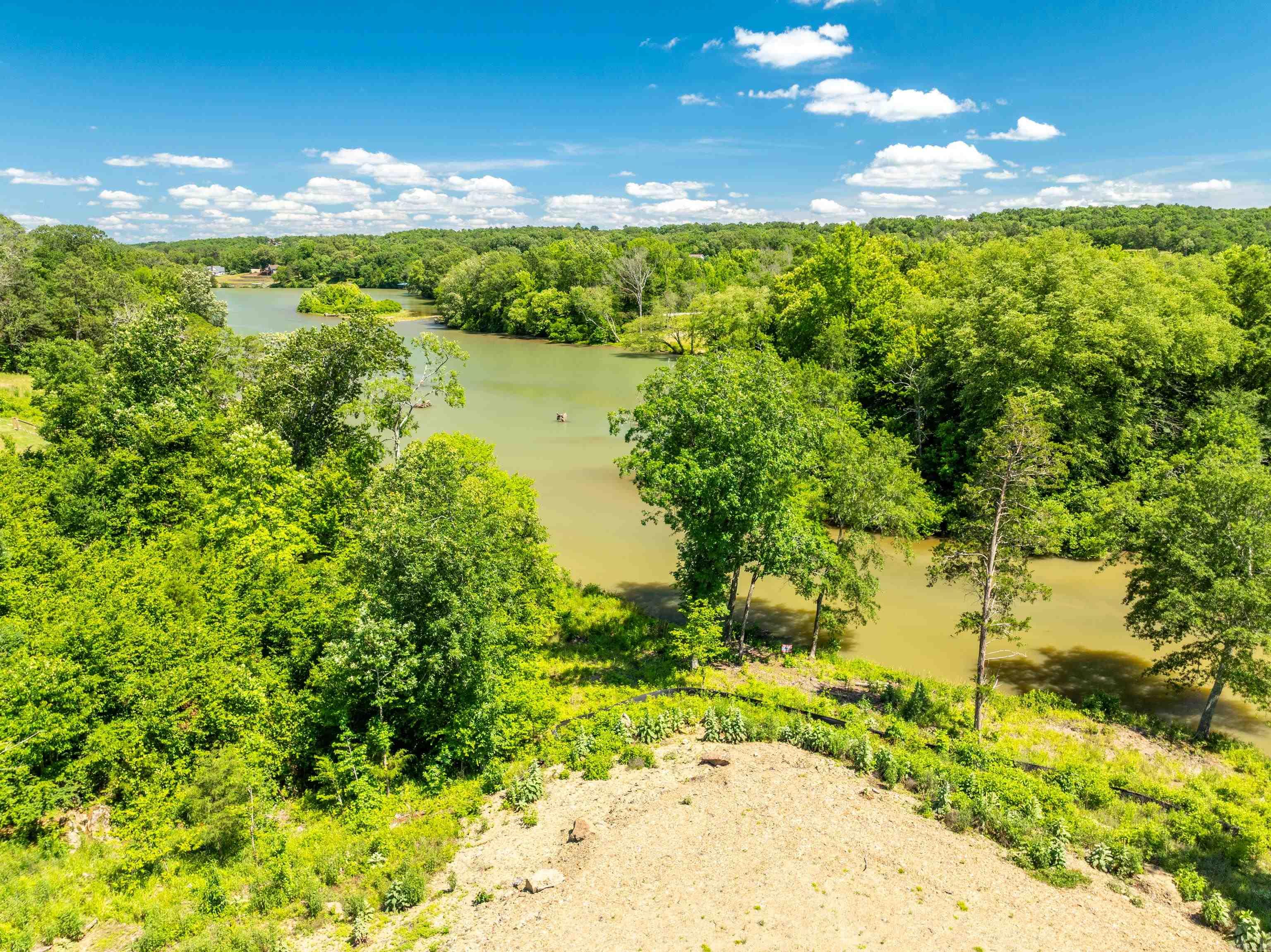 Welcome to your dream lakefront escape on Timberlake Rd. This extraordinary property spans over 5 acres and boasts an impressive 868 feet of shoreline, offering great views and endless possibilities for lakefront living. Whether you're envisioning a private estate, a family retreat, or a secluded haven, this property provides the perfect canvas.