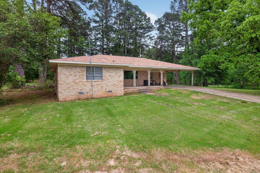 This wonderful maintained 3-bedroom, 2-bath home sits on 2.56 peaceful acres. Inside, enjoy a bright living area, a functional kitchen with plenty of storage, and a primary suite with a private bath. Two additional bedrooms offer space for family or guests. Outside, the expansive yard is ideal for gardening, recreation, or relaxing in privacy. A covered carport and storage shed add convenience. This home offers a quiet retreat—schedule your private showing today!