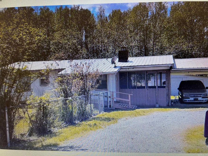 One level cottage on 1.14 acres  2 separate parcels. 008-00753-008  and 008-00753-008A. 2BR & 1.5BA. Living room and dining area. Laundry room at back of house. Attached one car carport, covered patio, detached garage/workshop with power. Agents see remarks.