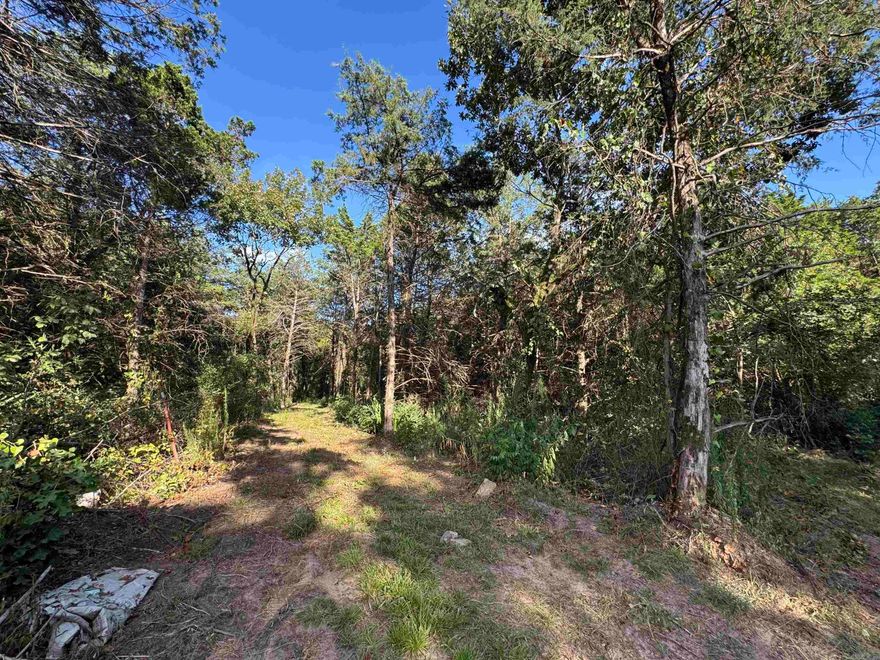 This gorgeous 2.5 acre tract m/l of raw forest land with utilities available!! Leveled and sloped plus wooded with a creek!! Whether you are looking to build your dream home. getaway or a perfect retreat location, this piece has so much to offer!  MORE land available at additional cost!!