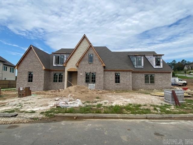 One of the rare level lots in sought-after Falstone, complete with stunning views! This brand-new custom brick and stone residence by Hartness Construction offers the perfect blend of luxury and livability with exceptional high-end finishes throughout. The main level boasts an inviting great room with fireplace, formal dining room, and a custom-designed kitchen with walk-in prep-kitchen & pantry. A private study provides the ideal space for working from home. The spacious owner’s suite features a spa-like bath, joined by two additional bedroom suites on the same floor for ultimate convenience. Upstairs, you’ll find a versatile playroom or media room and another full bedroom suite—perfect for guests or family. Enjoy outdoor living at its finest with a 658 sq. ft. covered porch, with fireplace, overlooking the flat backyard and sweeping views. A three-car side-loading garage completes this extraordinary property.