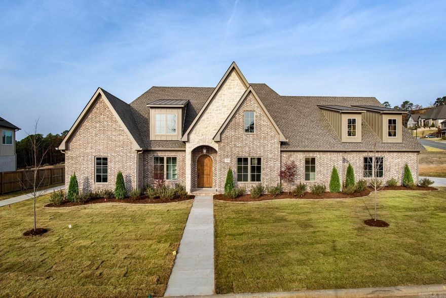 One of the rare level lots in sought-after Falstone, complete with stunning views! This brand-new custom brick and stone residence by Hartness Construction offers the perfect blend of luxury and livability with exceptional high-end finishes throughout. The main level boasts an inviting great room with fireplace, formal dining room, and a custom-designed kitchen with walk-in prep-kitchen & pantry. A private study provides the ideal space for working from home. The spacious owner’s suite features a spa-like bath, joined by two additional bedroom suites on the same floor for ultimate convenience. Upstairs, you’ll find a versatile playroom or media room and another full bedroom suite—perfect for guests or family. Enjoy outdoor living at its finest with a 658 sq. ft. covered porch, with fireplace, overlooking the flat backyard and sweeping views. A three-car side-loading garage completes this extraordinary property.