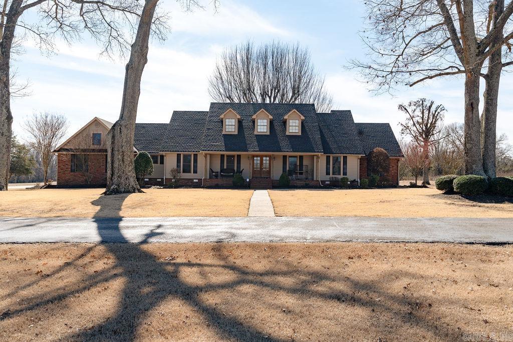 This Stunning 20 acre estate is located just outside the city limits of Searcy and has been meticulously maintained. The property includes a beautiful southern style, 4 bedroom home that features open living space, vaulted ceilings, bonus room/4th bedroom above the garage, primary suite that's been updated w/ double vanities, soaking tub, separate shower & huge walk in closet. If you love entertaining, you'll find gorgeous outdoor living space just outside the back door w/ a large deck, hot tub & woodturning fireplace that overlooks the pond & backyard. Also, there are two shops. The larger one has 6400 sq ft, is heated & has 3 overhead doors including 2 10x12 ft doors and one 14x14 ft door plus small office space & kitchenette thats heated and cooled. The smaller shop has 1200 sq ft w/half bath. Call today to see it for yourself!!!