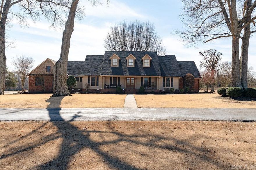 This Stunning 20 acre estate is located just outside the city limits of Searcy and has been meticulously maintained. The property includes a beautiful southern style, 4 bedroom home that features open living space, vaulted ceilings, bonus room/4th bedroom above the garage, primary suite that's been updated w/ double vanities, soaking tub, separate shower & huge walk in closet.  If you love entertaining, you'll find gorgeous outdoor living space just outside the back door w/ a large deck, hot tub & woodturning fireplace that overlooks the pond & backyard. Also, there are two shops. The larger one has 6400 sq ft, is heated & has 3 overhead doors including 2 10x12 ft doors and one 14x14 ft door plus small office space & kitchenette thats heated and cooled. The smaller shop has 1200 sq ft w/half bath. Call today to see it for yourself!!!