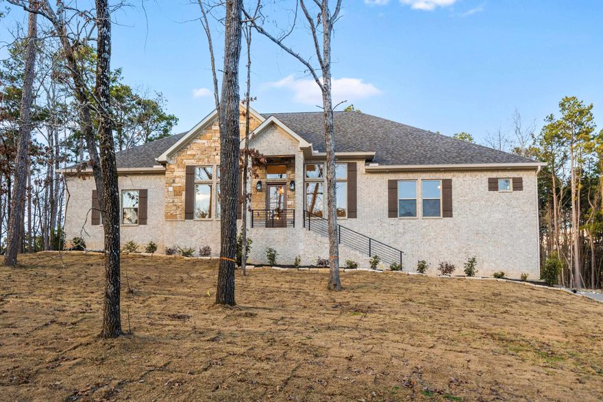 New Construction in  Highly Desired 7 South location.  Stunning Home with the features you are looking for. Beautiful wood beam ceilings  add charm to this open floorplan that welcomes your family and guests. Enjoy cozy holidays around the fireplace.  Large granite island in the chef’s kitchen, double ovens and  custom cabinets. The primary bedroom features walk in closet and ensuite with luxurious finishes. Stairs to attic for storage.  Deeded lake access. Lake Views , across the street from Lake Hamilton.