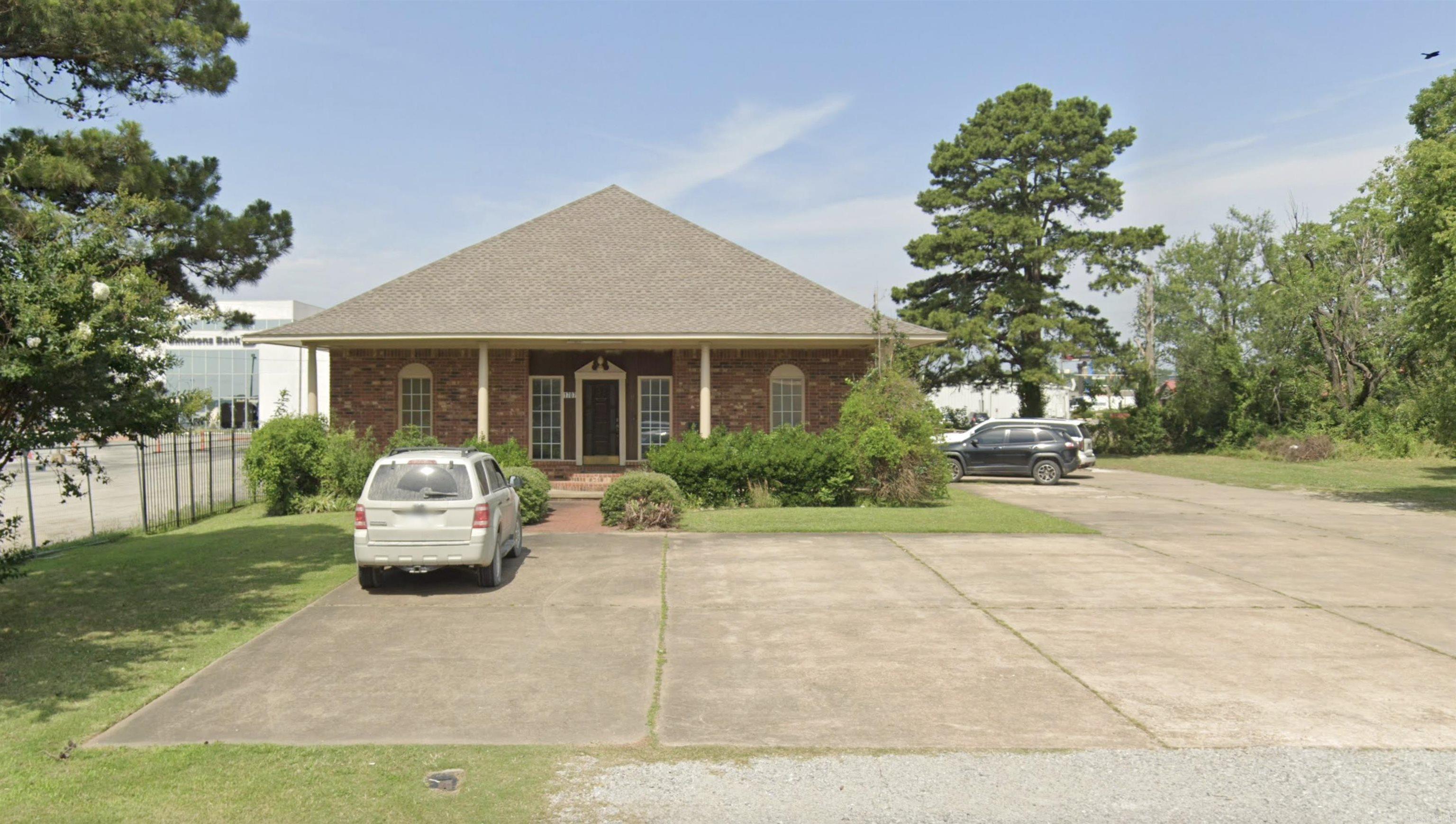 1707 Stone St offers 2,700± SF of professional office space in a standalone building just one block off a major thoroughfare in central Jonesboro. The layout features ten private offices, a reception area, kitchen, and two restrooms, ideal for professional, medical supply, or service-based users. Recent upgrades include a new roof (2022), energy-efficient LED lighting (2025), and hardwood flooring. The building has a rear handicap-accessible ramp for compliance and convenience, along with a covered front porch that provides an inviting entry. Paved parking for 12 vehicles supports clients and staff, while the unfinished second floor adds valuable storage or expansion potential. Utilities average just $300/month, and the tenant is responsible for utilities and maintenance. Previously used as a counseling center and corporate advertising office, the space adapts easily to various uses. Located near the new Simmons Bank, this property combines visibility, accessibility, and a quiet professional atmosphere.