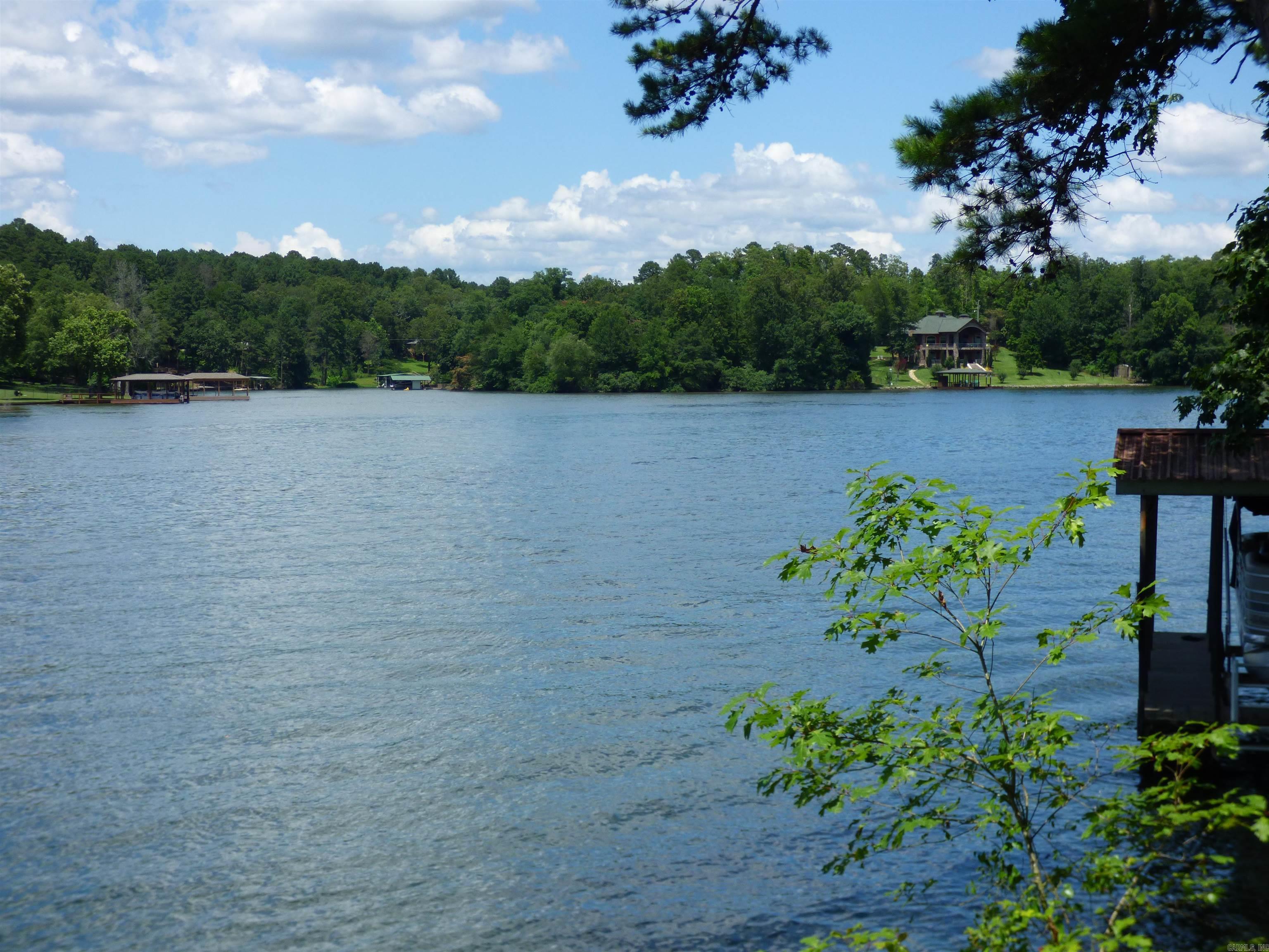 This is a great lake front lot with 100 feet on the main channel; Listing also includes a separate 1 acre triangular lot across the road. Triangular lot is surrounded by woods. Located about 15 minutes outside city limits.
